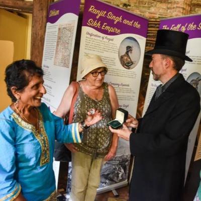 Visitors looking at artefacts